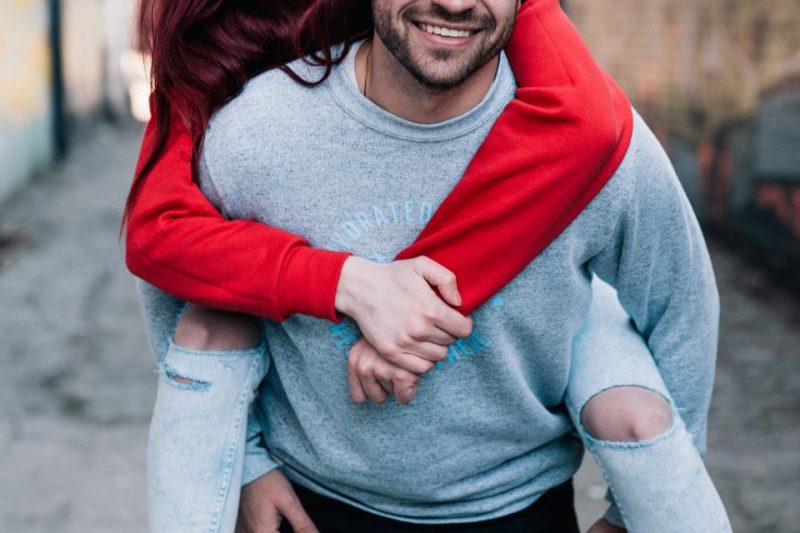 man facebook dating a woman in red sweater